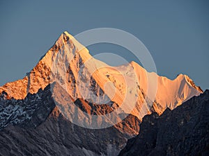 Beautiful golden Snow Mountain, Peak Jambeyang photo