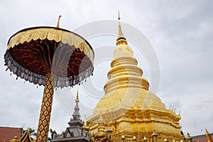 beautiful golden stupa at Wat Phra That Haripunchai temple at Lamphun province, Thailand