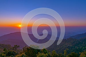 Beautiful golden sunrise and colorful blue sky over the hills and canyons in chiang mai,Thailand