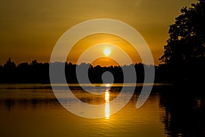 Beautiful golden sunset reflecting on a lake