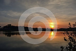 A beautiful golden sunset/sun rise on the lake. landscape background.