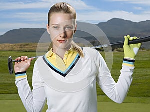 Beautiful Golfer With Club On Golf Course