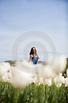 Beautiful gorgeous woman in white flower field