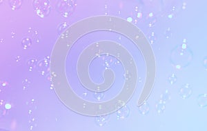 Beautiful gradient colors purple, blue background with soap bubbles float in the air