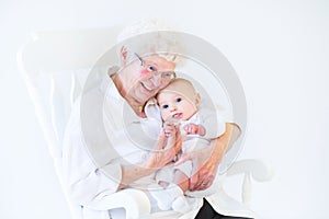 Beautiful grandmother singing to newborn grandson