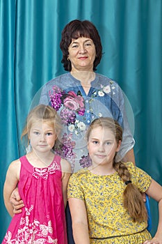 Beautiful grandmother with two granddaughters.