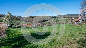 Beautiful grass-covered hill under the clear blue sky captured in Rohrbach, Odenwald in Germany