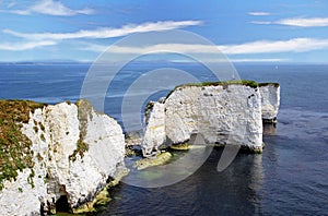 The beautiful grass covered white chalk cliffs of Old Harry Rocks in Dorset
