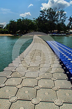 Beautiful gray and blue pontoon made from plastic floating in th