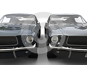 Beautiful gray and dark blue vintage American muscle cars - front view closeup shot