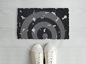 Beautiful Gray Rose Solid Sparkle Pattern entry designer doormat with white sneaker shoes
