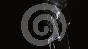 Beautiful gray smoke on a black background. Cigarette smoke. Smoke from the hookah. Turbulence of smoke. The white vapor