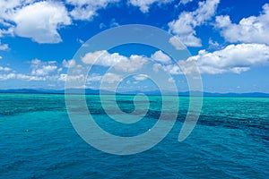 beautiful great barrier reef with white clouds on a sunny day, cairns, australia