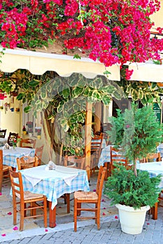 Beautiful greek taverna with bougainvillea flowers