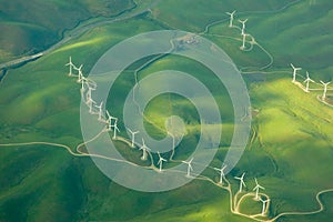 Beautiful green aerial view of windmill farm