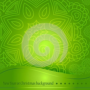 Beautiful green background with ornament for Christmas. A circular ornament, mandala. Celebratory bright background for