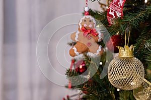 Beautiful green christmas tree decoration with toys and ribbons