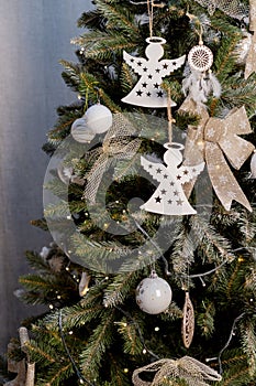 Beautiful green   christmas tree decoration with toys and ribbons