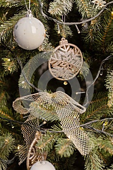 Beautiful green christmas tree decoration with toys and ribbons