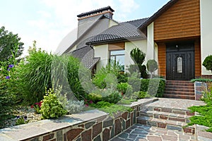 Beautiful green garden near modern house  sunny day