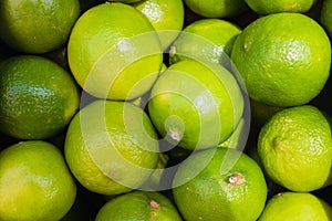 Beautiful Green lime pattern background. Limes in a box in the market