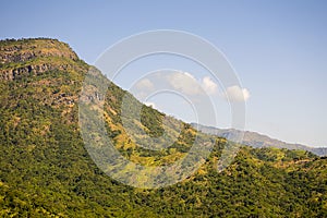 Beautiful green mountains/Hills with blue sky background. photo