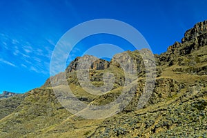 Beautiful and green Sani pass among Drakensberg mountains in Sou