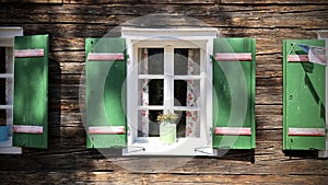 Beautiful green shutters and white window on typical and traditional austrian alpine wooden house - Salzkammergut