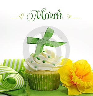 Beautiful green and yellow Spring theme cupcake with doffodils and decorations for the month of March