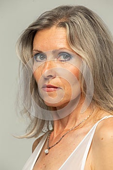 Beautiful grey-haired fifty year old woman