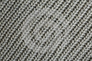 Beautiful grey knitted fabric as background, top view