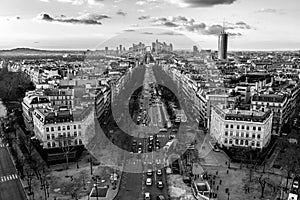 Beautiful greyscale aerial view of the road with the cars and the cityscape of Paris, France