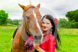 Beautiful gypsy girl with a horse