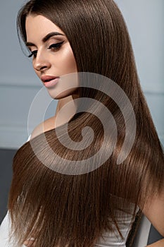 Beautiful Hair. Woman Model With Glossy Straight Long Hair