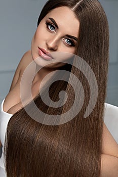 Beautiful Hair. Woman Model With Glossy Straight Long Hair.