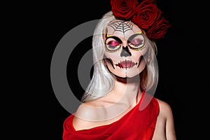 Beautiful Halloween Make-Up Style. Blond Model Wear Sugar Skull Makeup with Red Roses. Santa Muerte concept