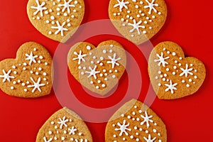 beautiful hand-baked cookies in the shape of a heart on a red background