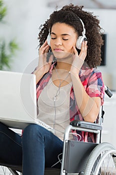 Beautiful handicaped woman listening to music and relaxing