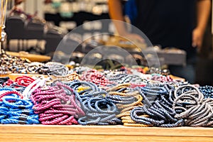 Beautiful handmade colorful bracelets standing on the counter