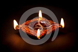 A beautiful Handmade Designer Clay Lamp with burning wick