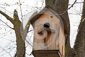 Beautiful handmade wooden birdhouse for wintering birds and squirrels