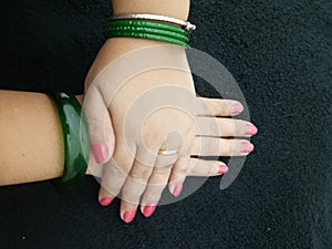 Beautiful hands with lovely nailpaint red and green combination photo