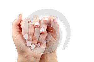 Beautiful hands with manicure young woman on white background