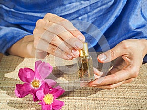 Beautiful hands of a Muslim woman with a perfume. Hands of a woman with perfume.