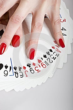 Beautiful hands with perfect manicure and cards