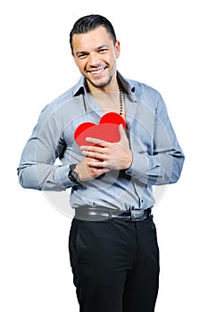 Handsome young macho man holding love heart