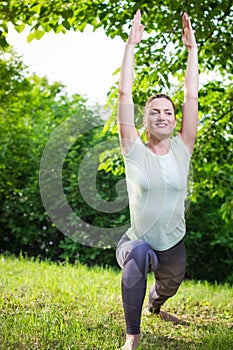 Young woman exercising outdoors in nature