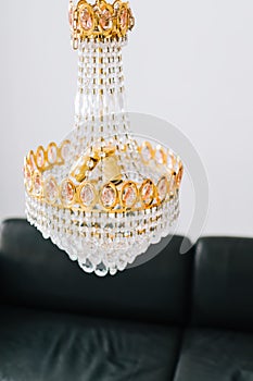 Beautiful hanging chandelier in the living room close-up