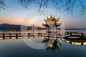 Beautiful hangzhou in sunset and ancient pavilion