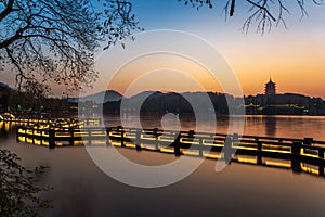 Beautiful hangzhou in sunset and ancient pavilion